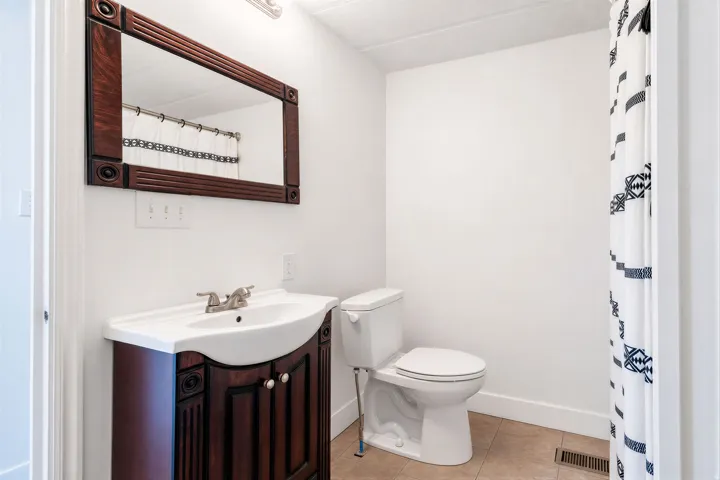 White walls with light-toned floor tiles
