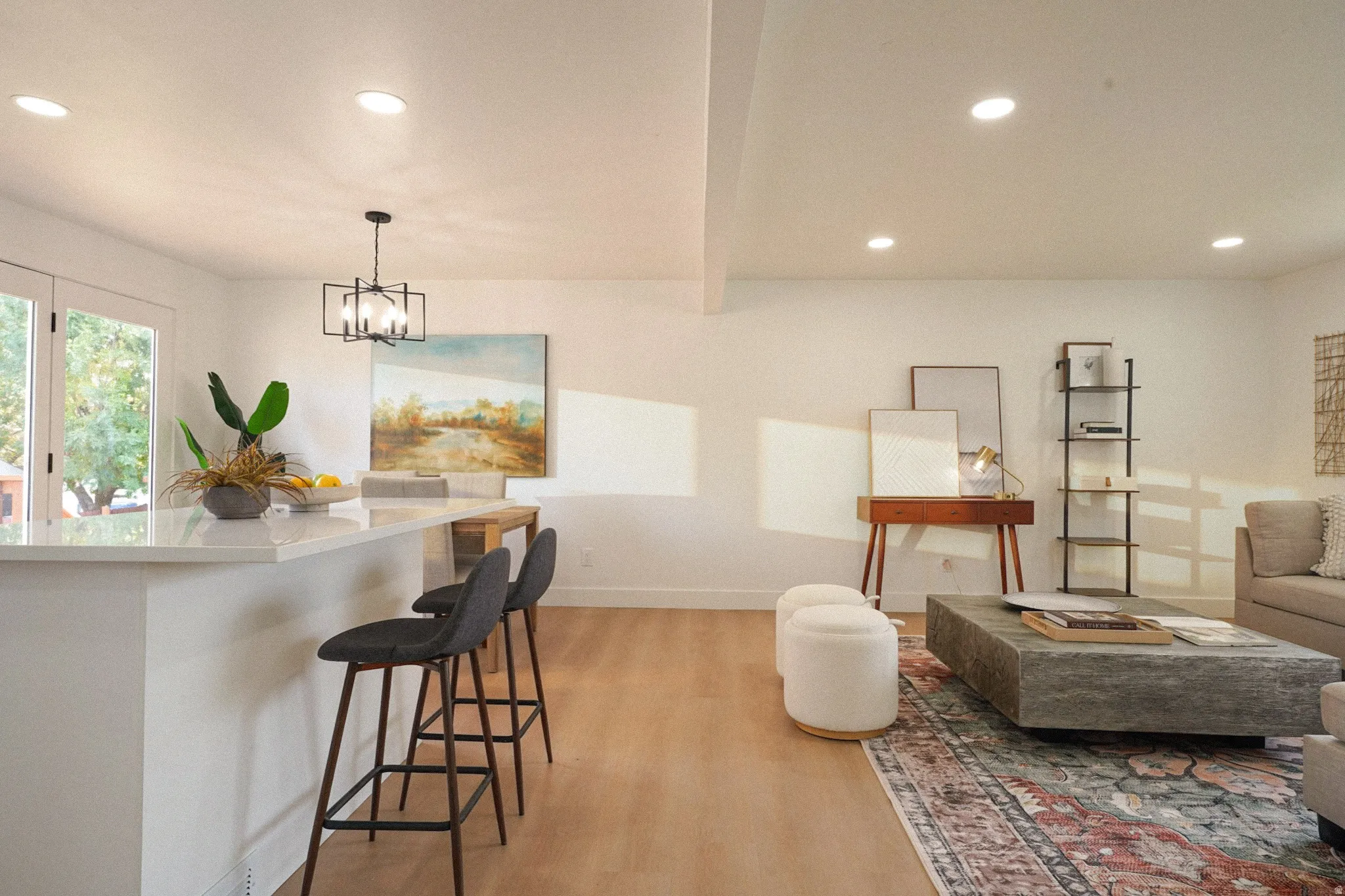 Recessed lighting with light wood-finish flooring