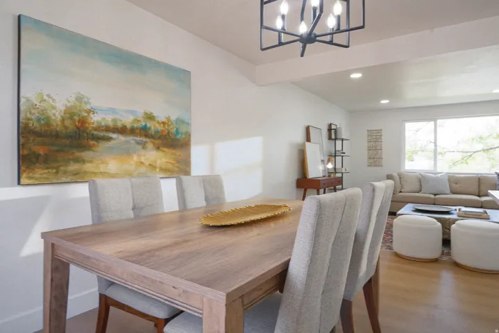 Open-concept living area with wood-finish flooring