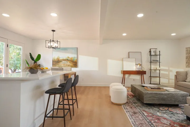 Recessed lighting with light wood-finish flooring