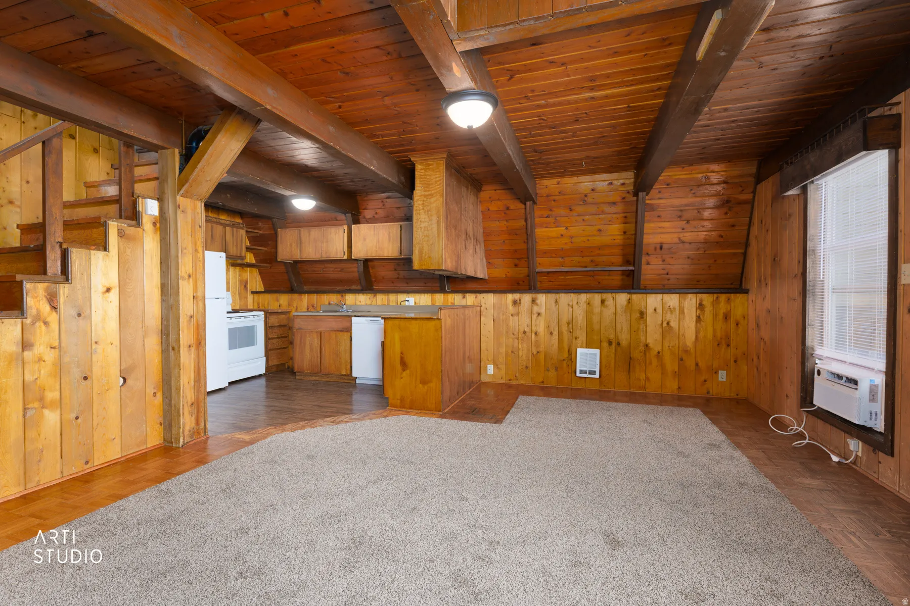 Wood-paneled walls and ceiling with exposed wood beams
