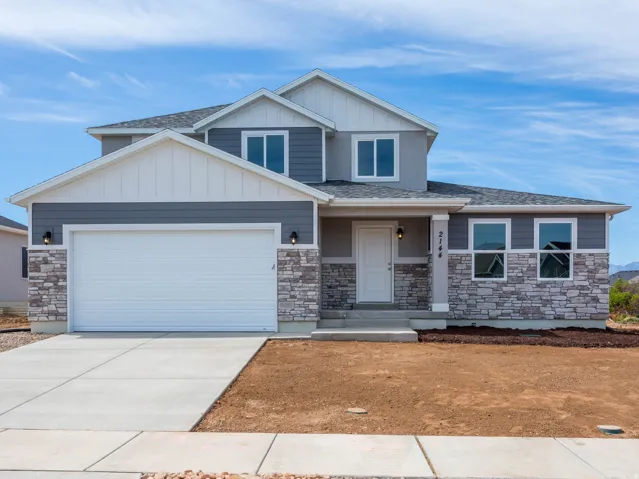 Two-story exterior with a stone veneer and horizontal siding