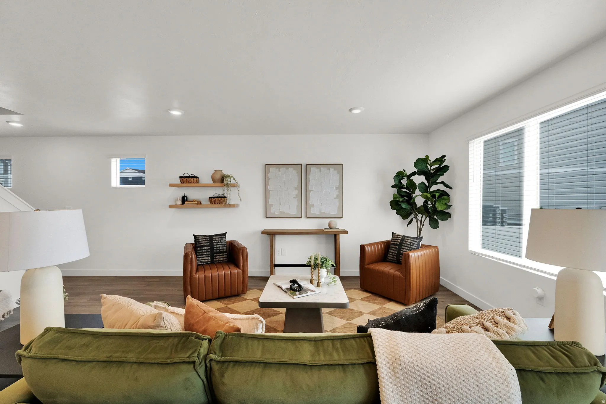 Recessed lighting, wood-finish flooring, white walls, and multiple windows with blinds