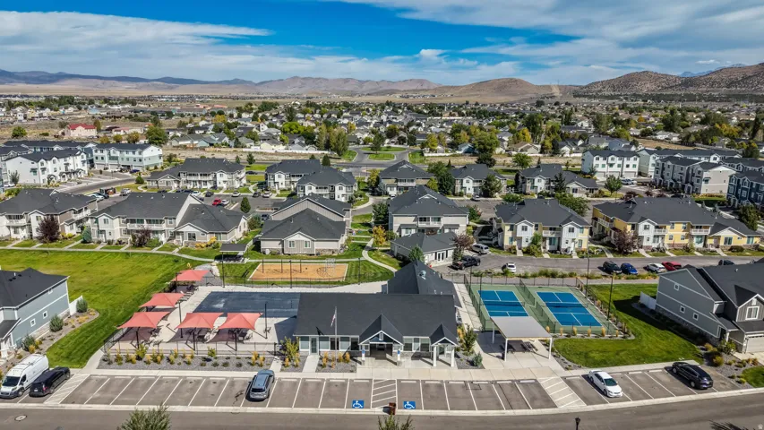 Community amenities include a dedicated parking area, pickleball courts, covered outdoor seating, and a playground