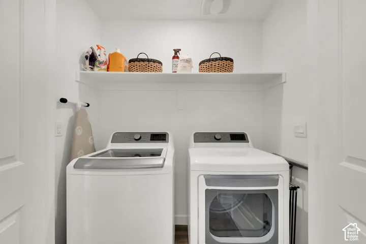 Dedicated laundry area featuring a built-in white shelf