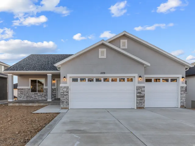 Contemporary exterior with stucco siding and stone accents