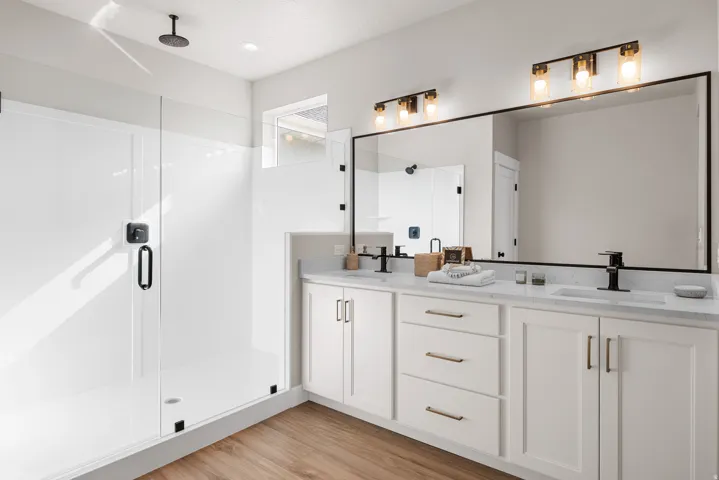 Dual vanity with white cabinetry and quartz countertops