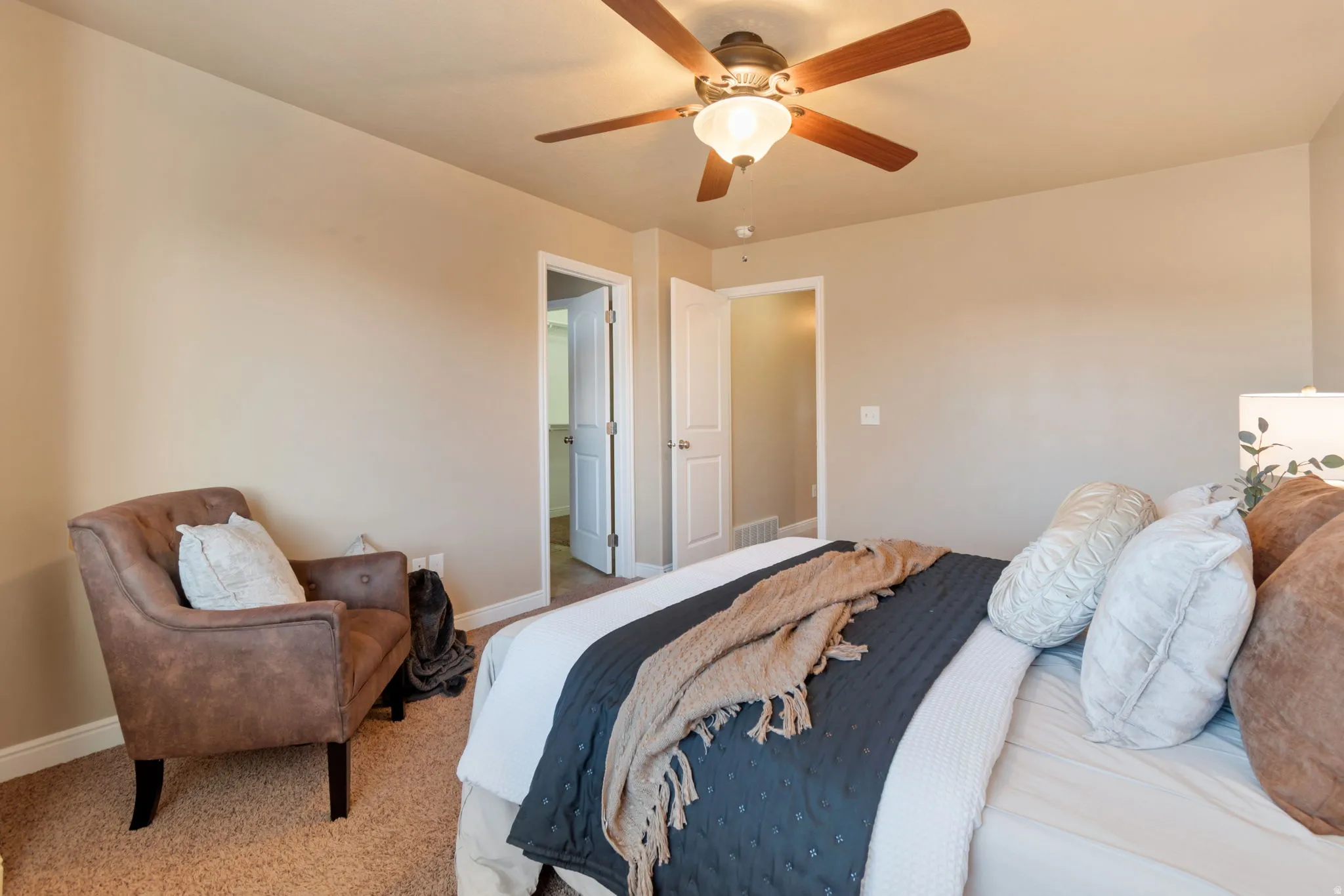 Primary Bedroom.  Recessed lighting, ceiling fan with wood-finish blades, and carpeted flooring