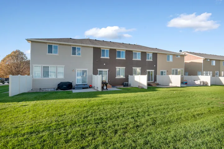 Rear Entry at Patio.  Expansive green space with defined patio areas