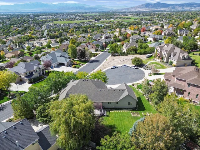 Expansive residential area with mature landscaping, defined roadways, and multiple architectural styles