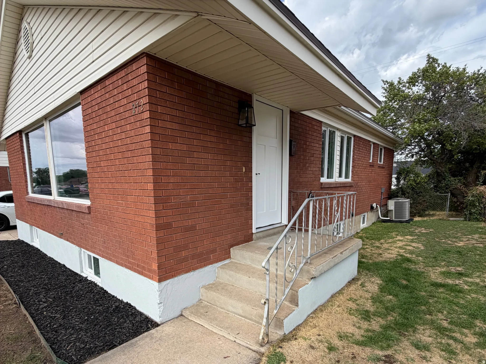 Red brick exterior with white trim