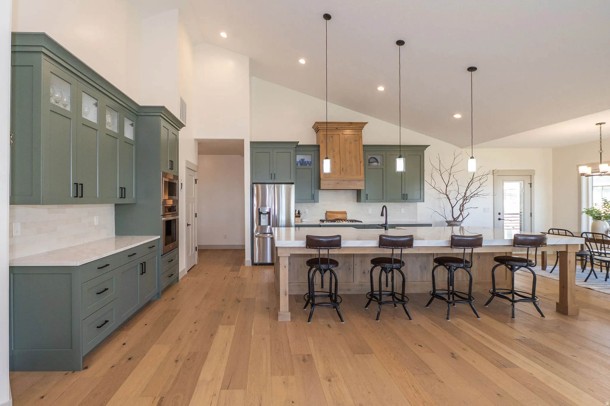 Hallway on Left Side of Kitchen Takes You To Bench Area, Garage and Half Bath
