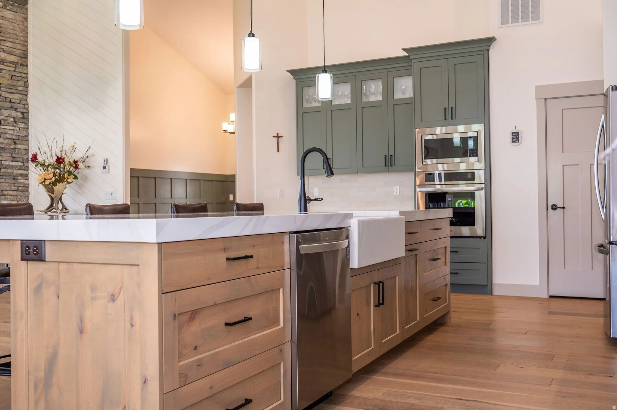 White Farmhouse Sink and Stainless Steel Appliances
