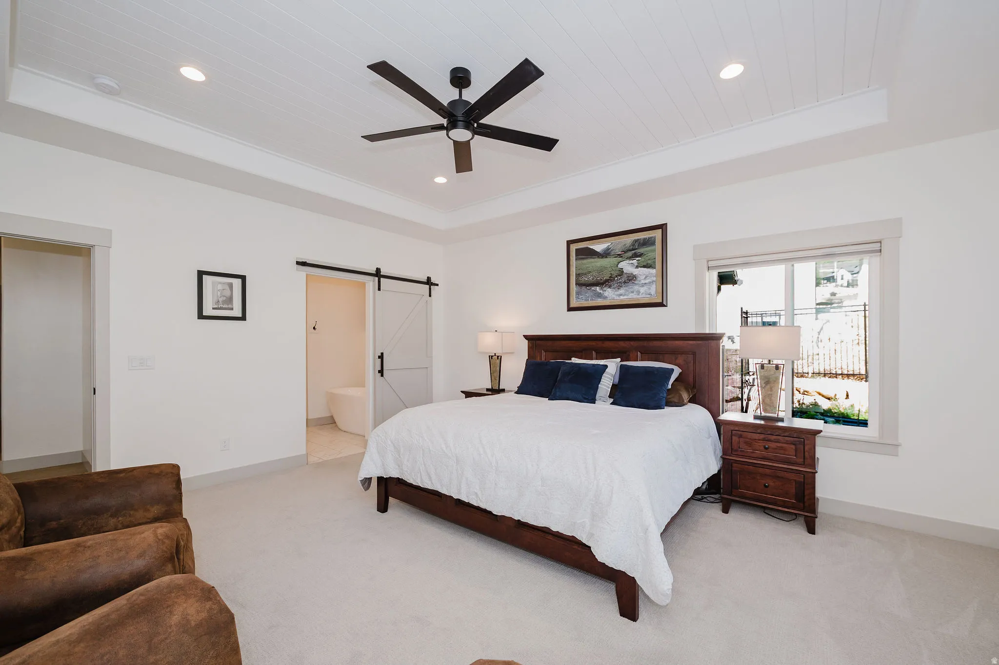 Primary Bedroom with Barn Door Leading the Bathroom