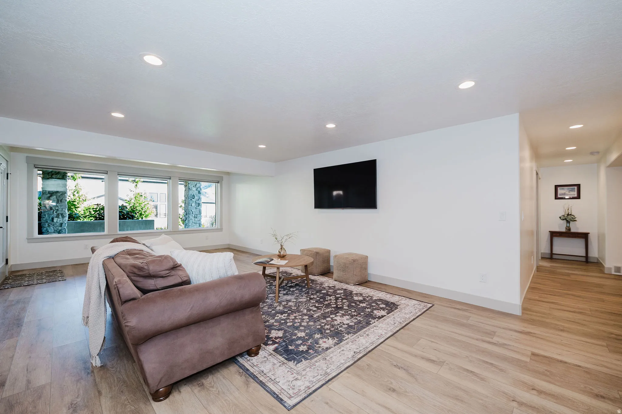 Living Room With Daylight Basement, Recessed Lighting, And Multiple Large Windows