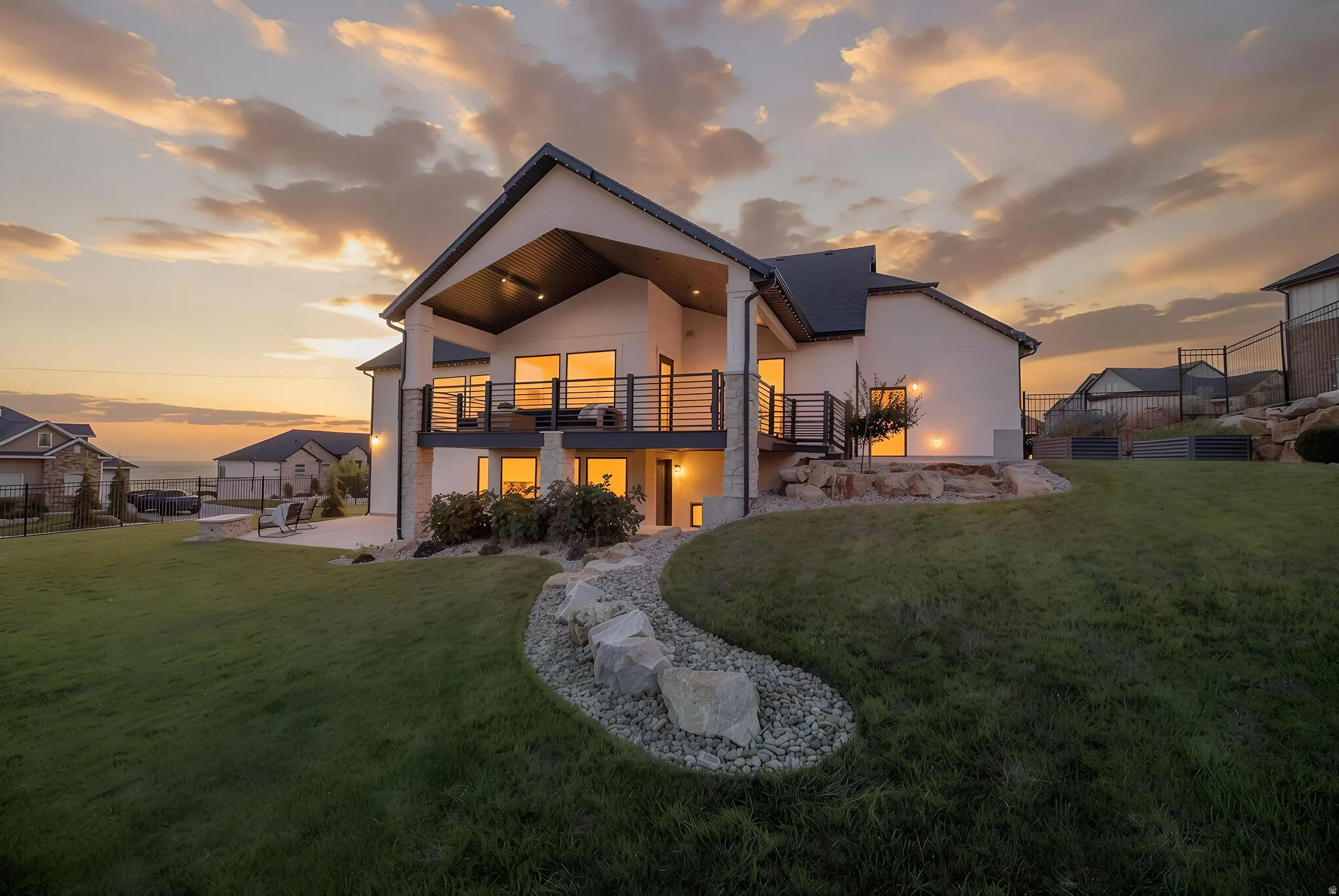 Twilight Exterior With Manicured Lawn