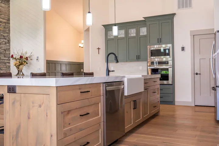 White Farmhouse Sink and Stainless Steel Appliances