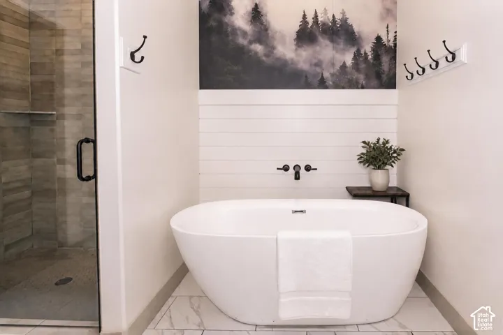 Primary Bathroom with Freestanding Tub and Tiled Shower with Double Shower Heads