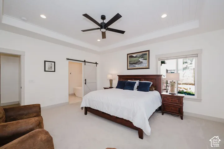 Primary Bedroom with Barn Door Leading the Bathroom