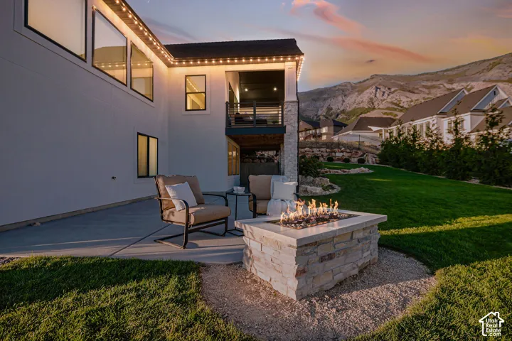 Stone-clad Gas Fire pit and a Covered Upper-Level Deck Makes for the Best Time Enjoying Evening Sunsets