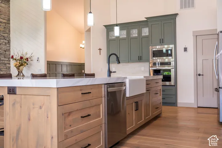White Farmhouse Sink and Stainless Steel Appliances