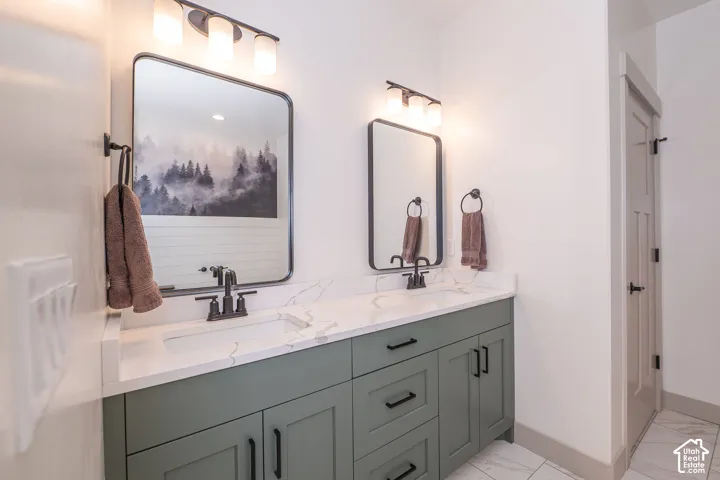 Primary Bathroom with Dual Undermount Sinks with Matte Black Faucets And Toilet Closet