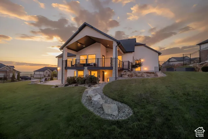 Twilight Exterior With Manicured Lawn