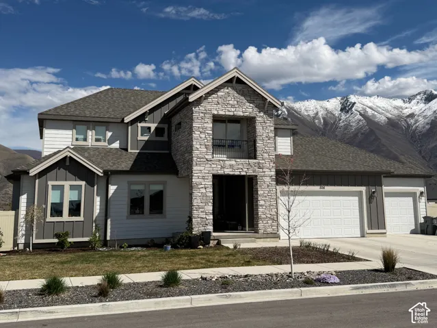 Contemporary exterior featuring a stone and siding facade