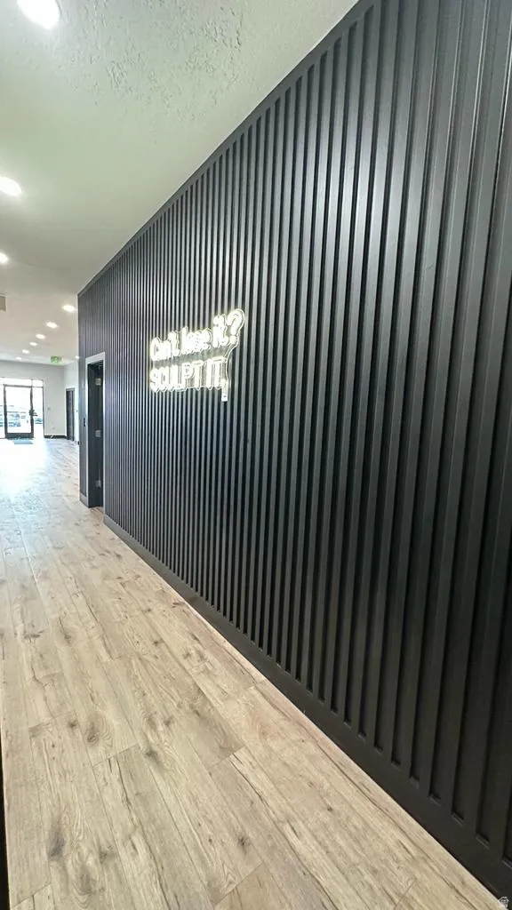 Wood-finish flooring with a textured wall paneling