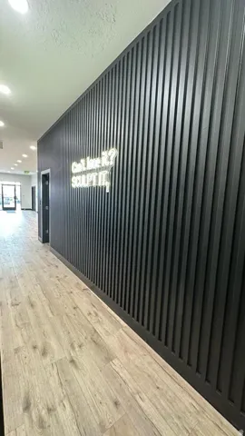 Wood-finish flooring with a textured wall paneling