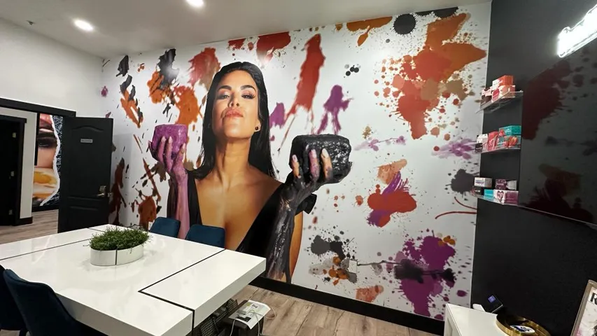 White walls featuring large-scale graphics and paint splatters