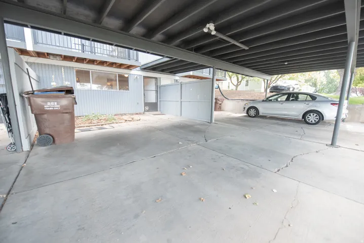Covered parking space with concrete flooring