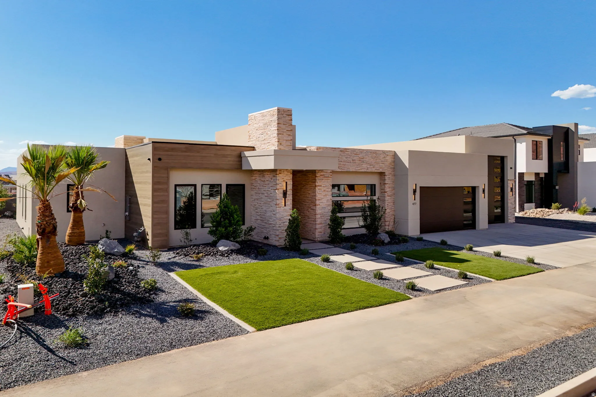 Modern exterior architecture featuring a flat roof and stucco finish