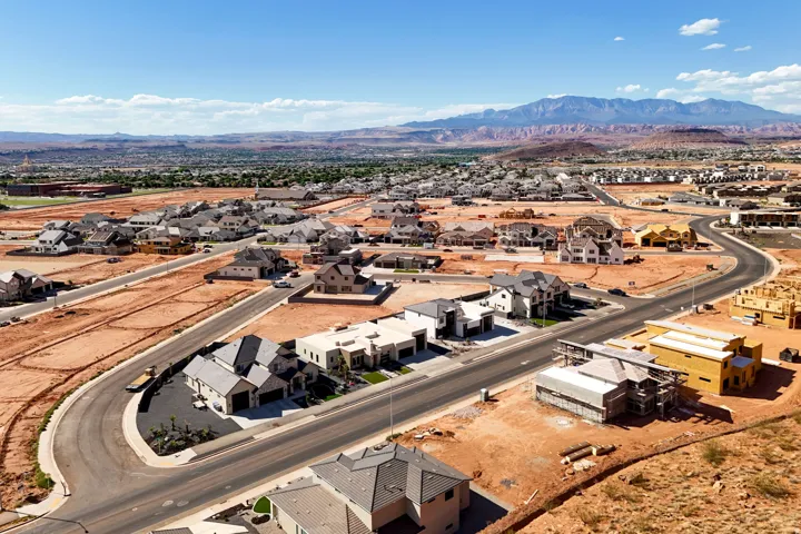 Expansive residential development featuring paved roads and building sites