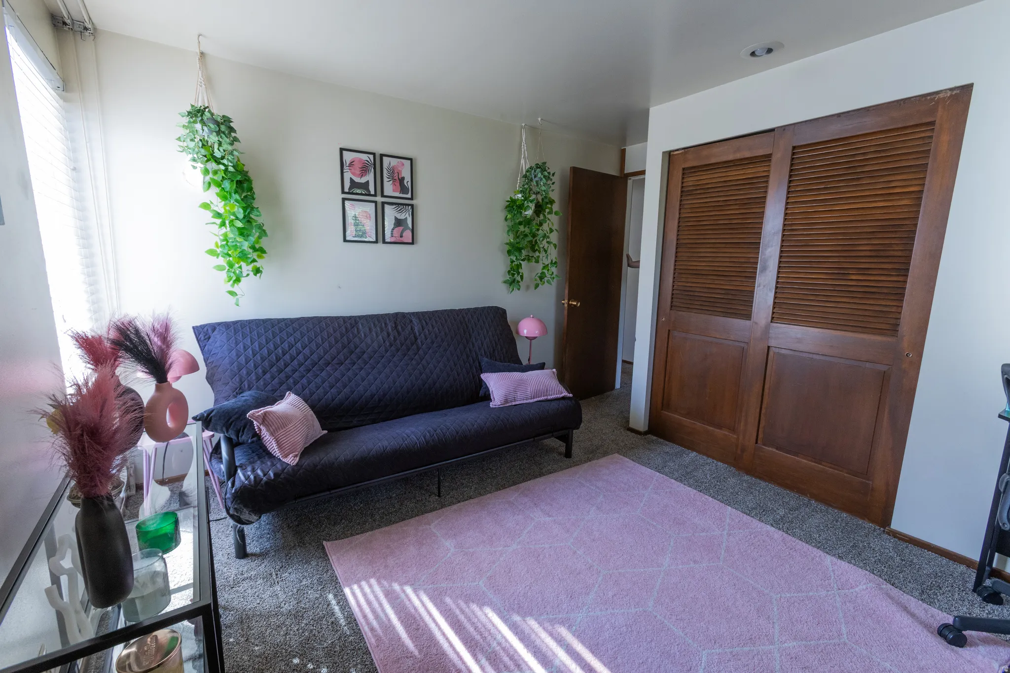 Recessed lighting, wood-finish louvered closet doors, and wood-finish interior door