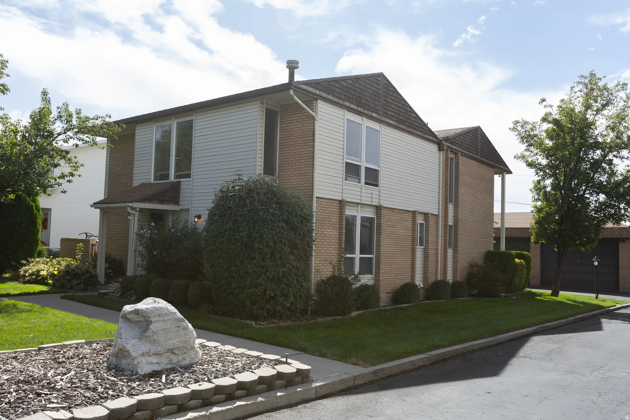 Brick and siding exterior with a gabled roof