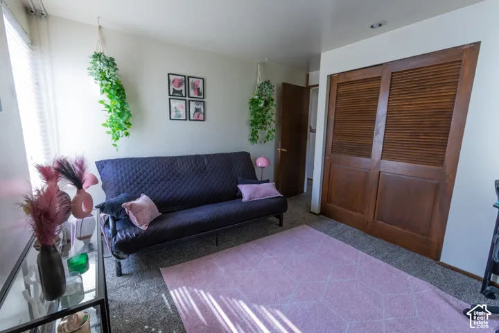 Recessed lighting, wood-finish louvered closet doors, and wood-finish interior door