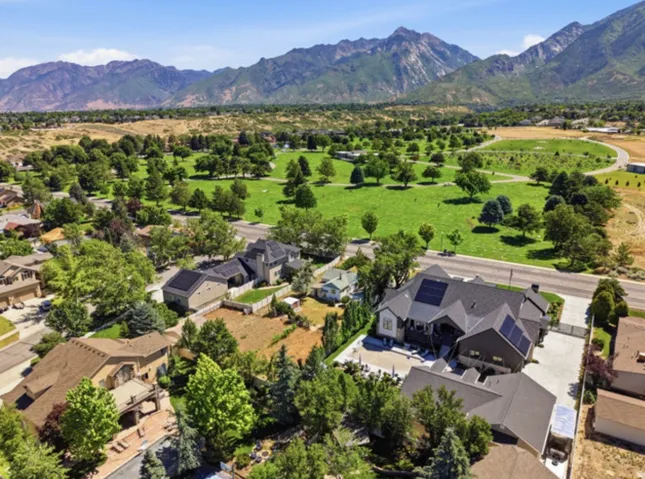 Expansive mountain backdrop with a substantial green space