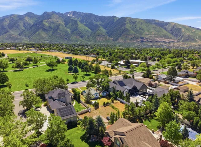 Neighborhood featuring mature trees and mountain scenery
