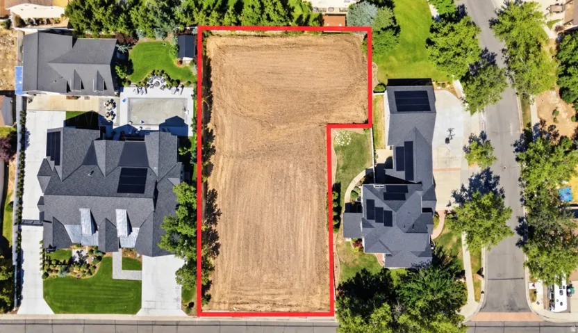 Expansive vacant lot featuring a cleared surface and distinct property lines