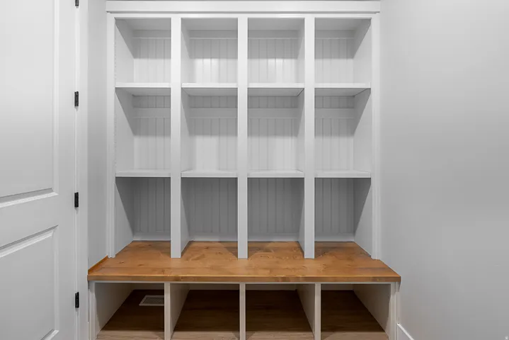 Built-in storage cubbies with wood-finish bench seating