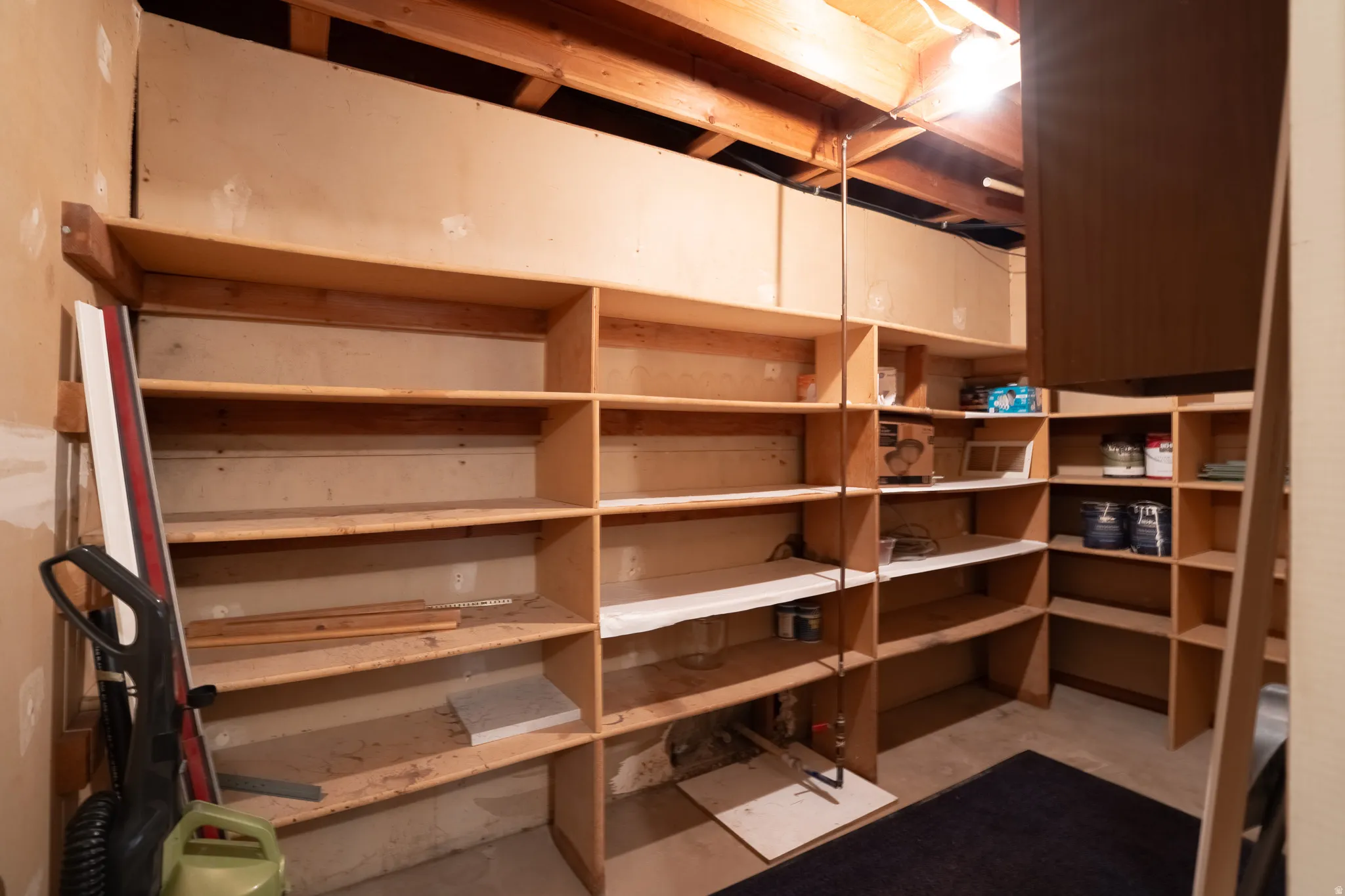 Built-in wood shelving units provide extensive storage