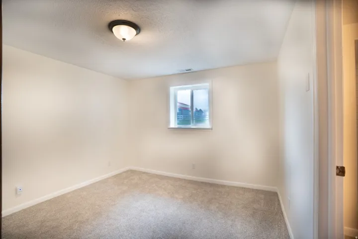 Bedroom 4 with new windows, carpet, baseboards