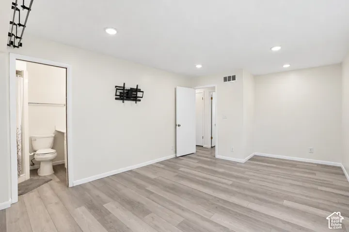Spacious primary bedroom featuring primary bathroom