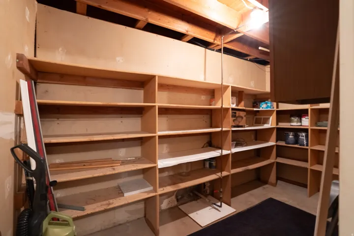 Built-in wood shelving units provide extensive storage