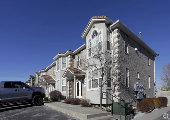 Multi-story exterior with a combination of brick and stucco siding
