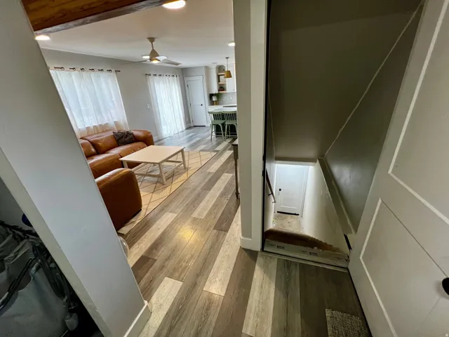 Open concept living space featuring wood-finish flooring, recessed lighting, and a ceiling fan