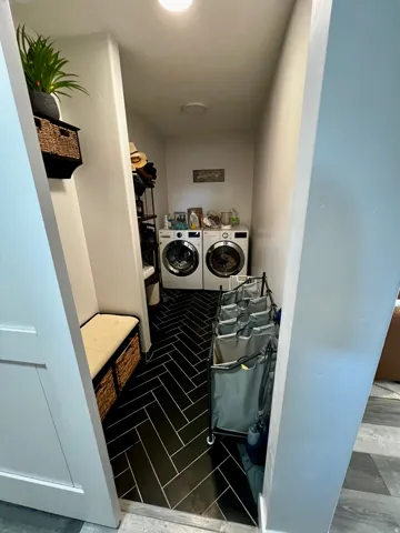 Black herringbone tile flooring