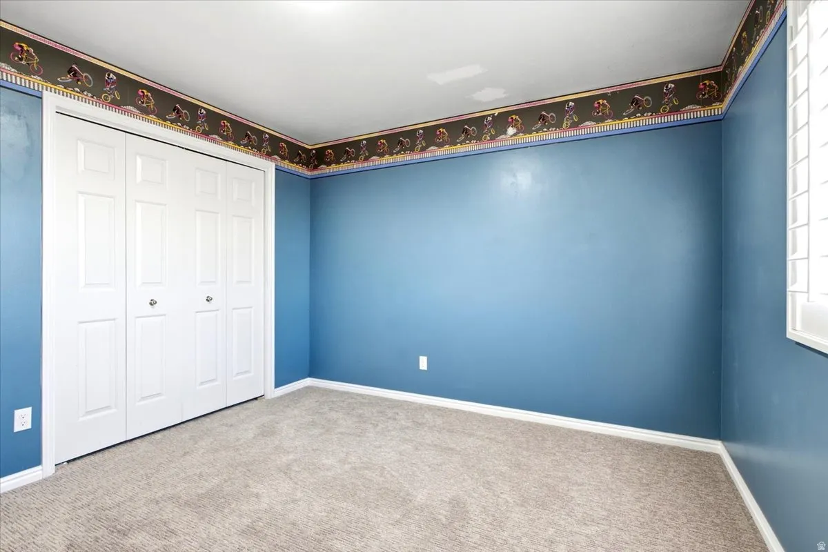 Wall-to-wall carpeting and white trim throughout