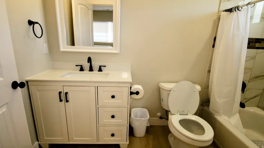 White shaker vanity with a light-toned countertop